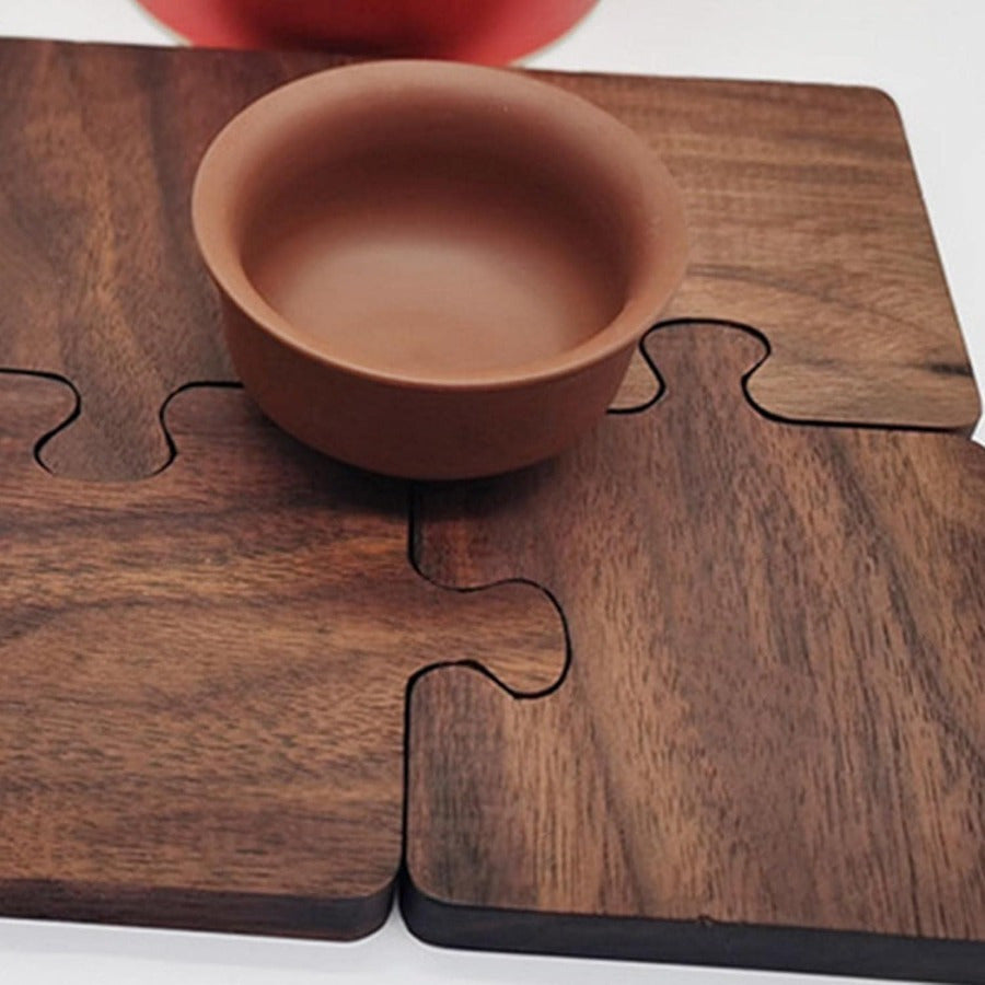 Heat resistant wooden coaster set made of puzzle pieces